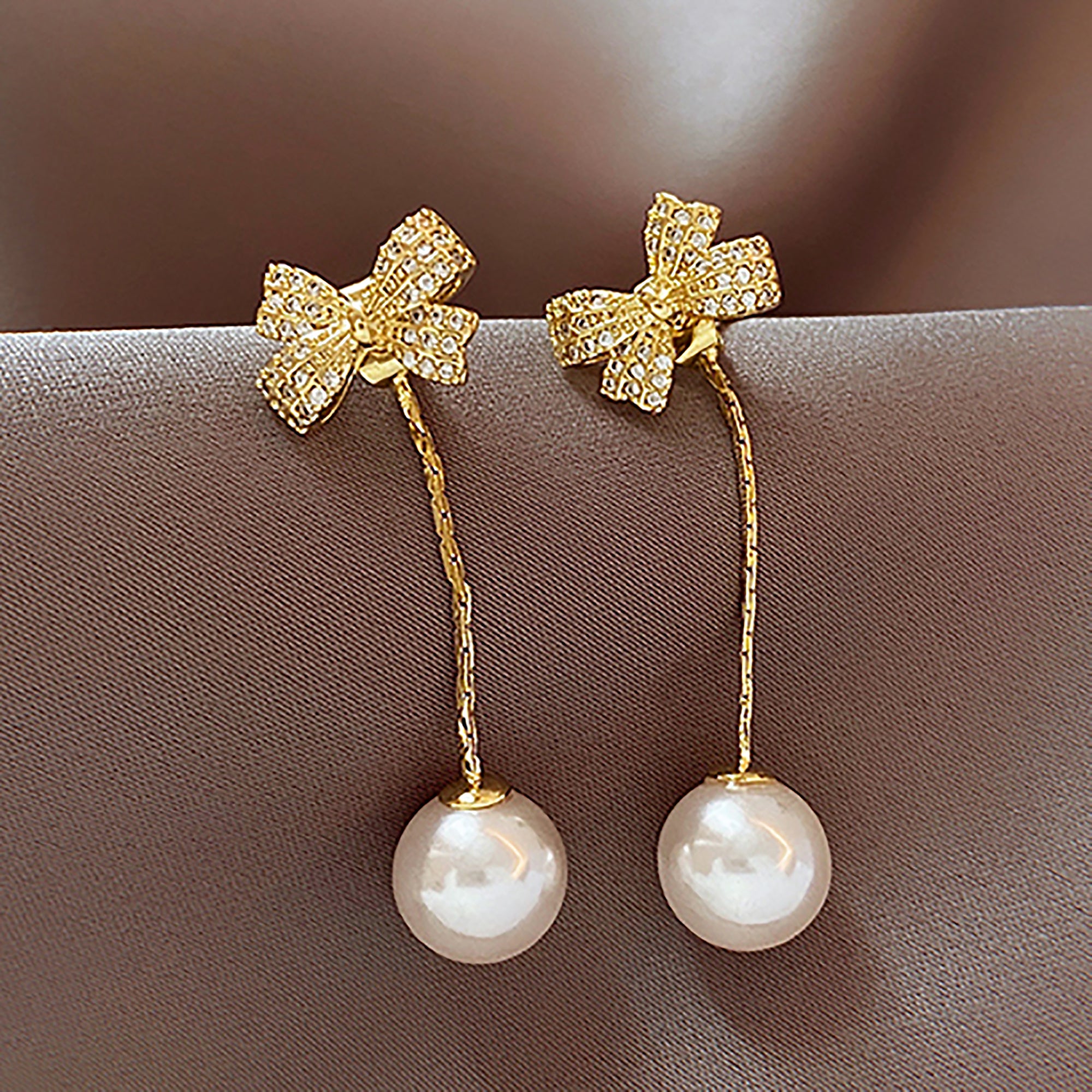 Gold Plated Pearl Dangle w/ CZ Bow Earrings