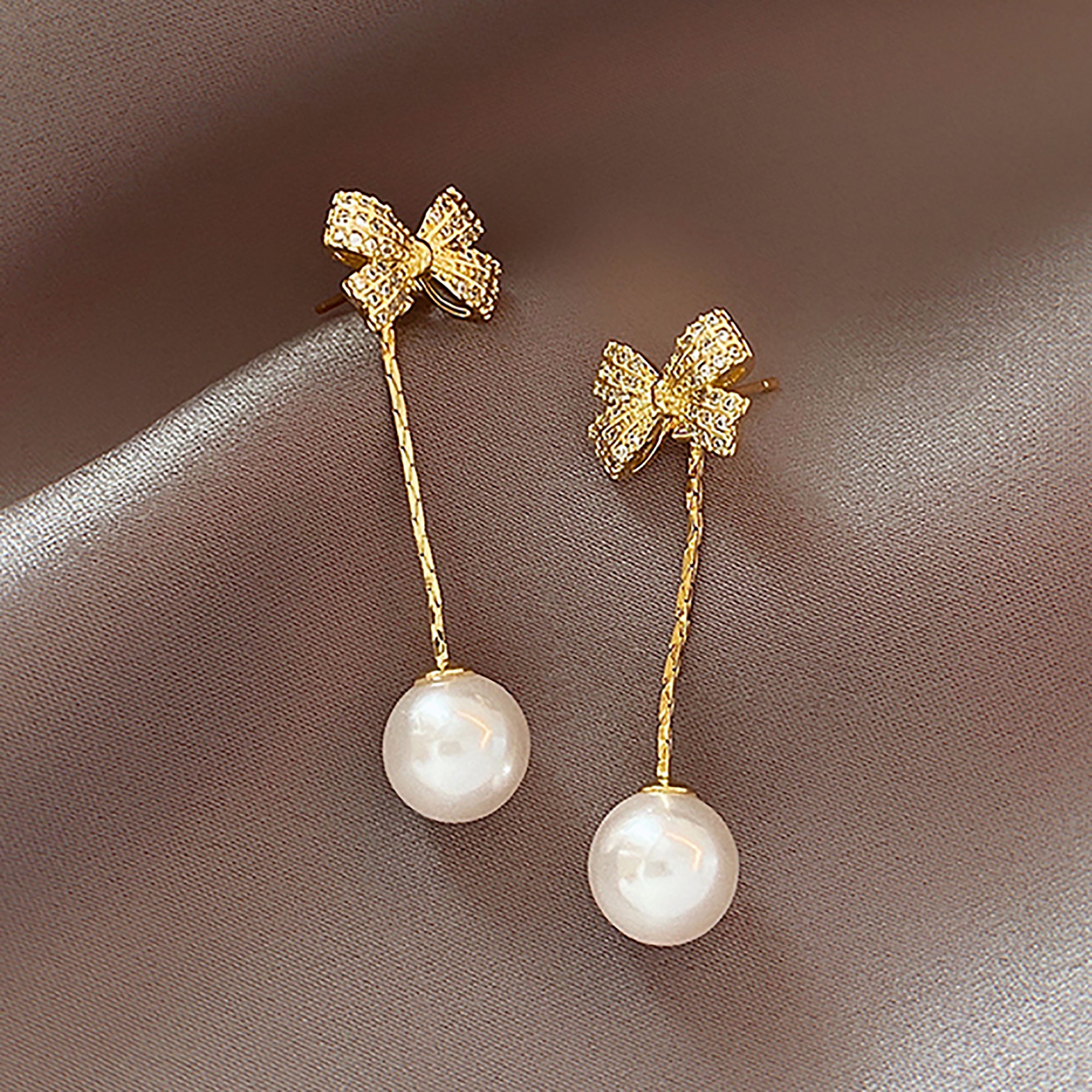 Gold Plated Pearl Dangle w/ CZ Bow Earrings